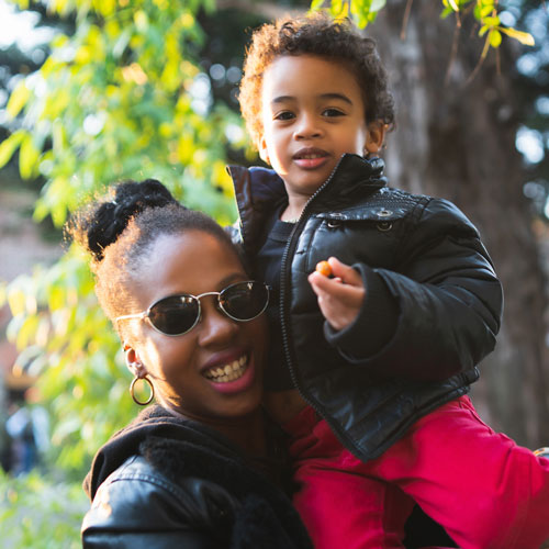 Smiling mother and daughter featured in a patient testimonial for InterCommunity Health Care.