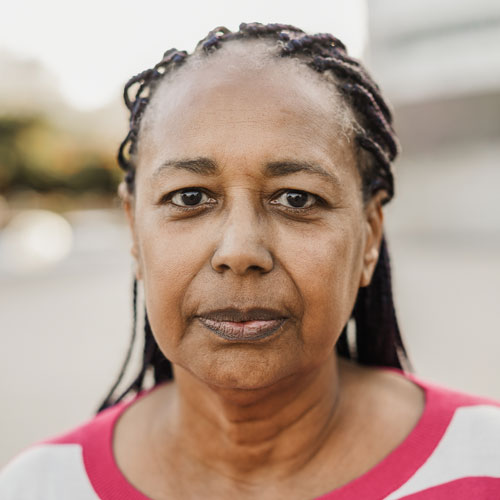 Smiling woman sharing a positive testimonial for InterCommunity Health Care.